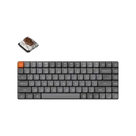 Keychron K3 Max tri-mode mechanical keyboard featuring black and gray keycaps with an orange accent key and brown switches.